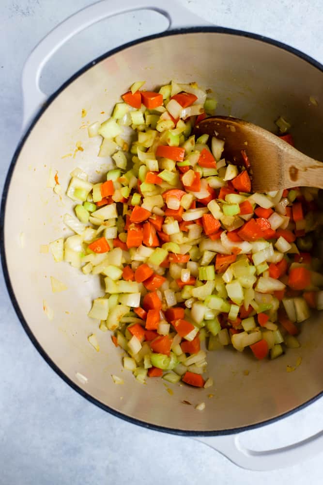 Sautéing aromatics for soup in a large dutch oven.