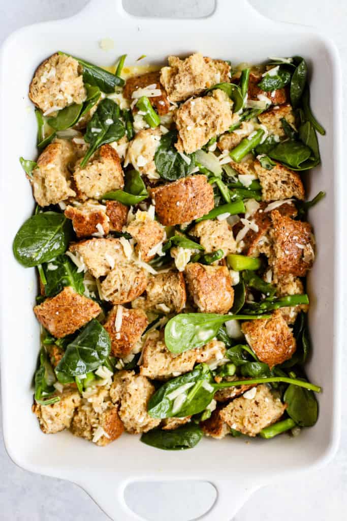 Breakfast strata ingredients in a baking pan.