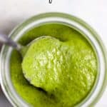 Basil vinaigrette in small jar with spoon.