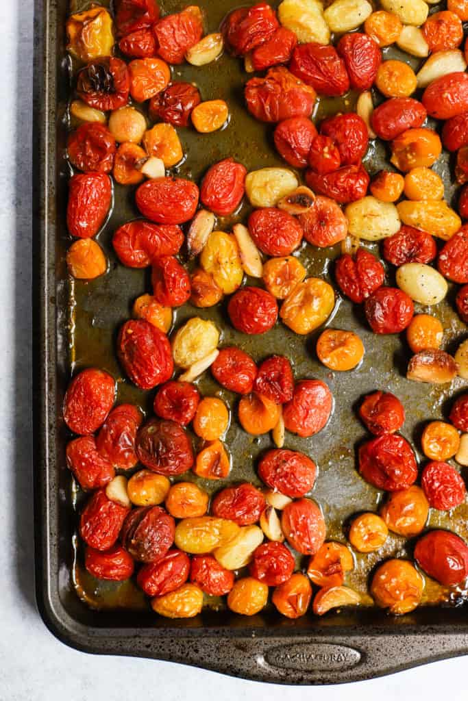 Garlic roasted tomatoes on sheet pan