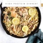Chicken with leeks and farro in a cast iron skillet.