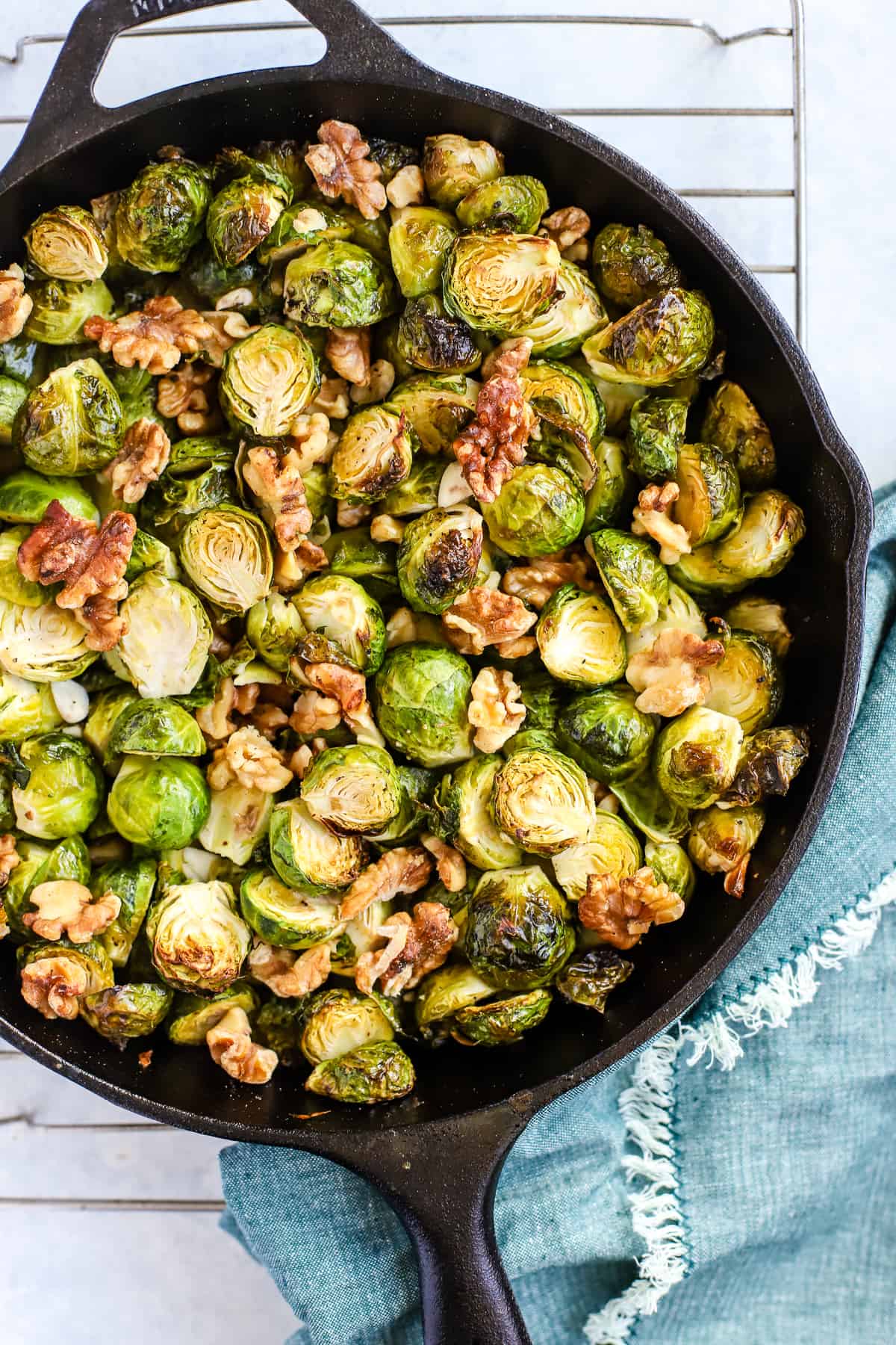 Maple walnut roasted Brussels sprouts in black cast iron skillet.