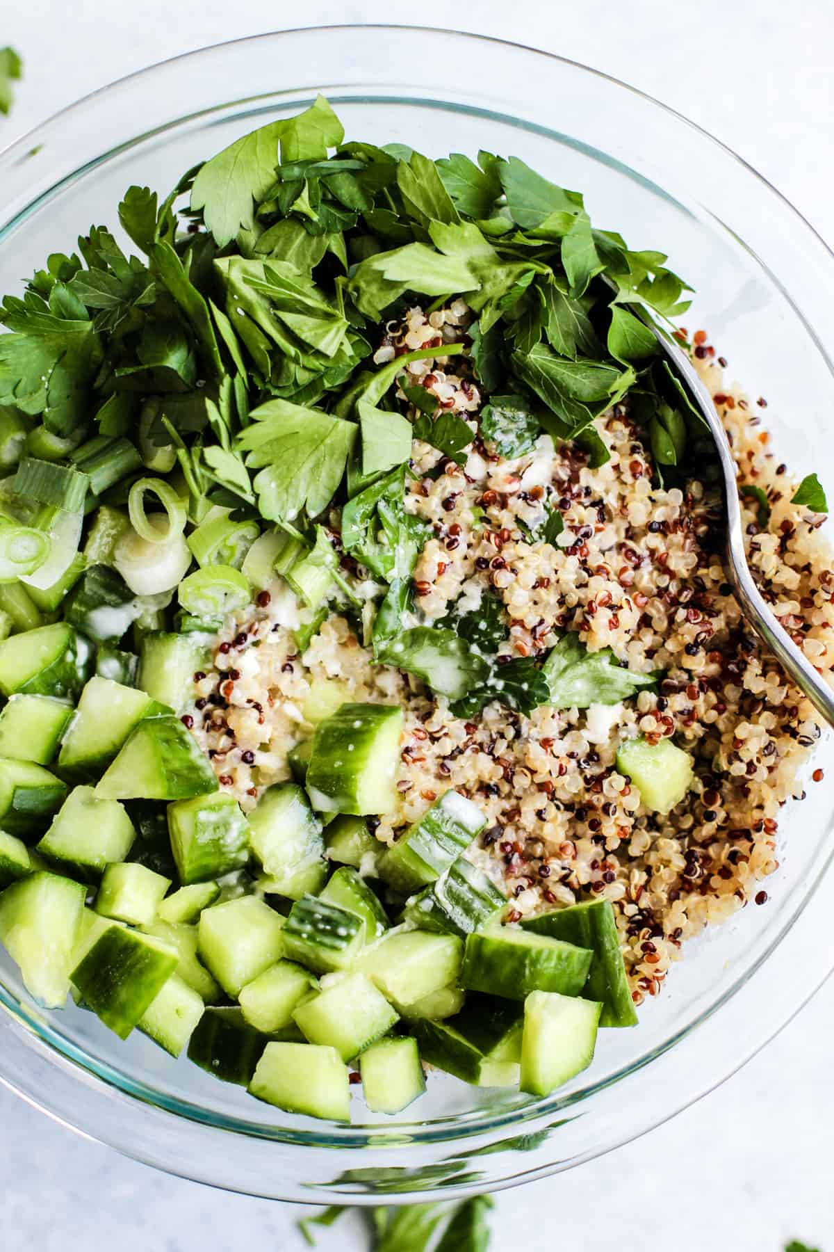 Dressing poured onto quinoa salad.