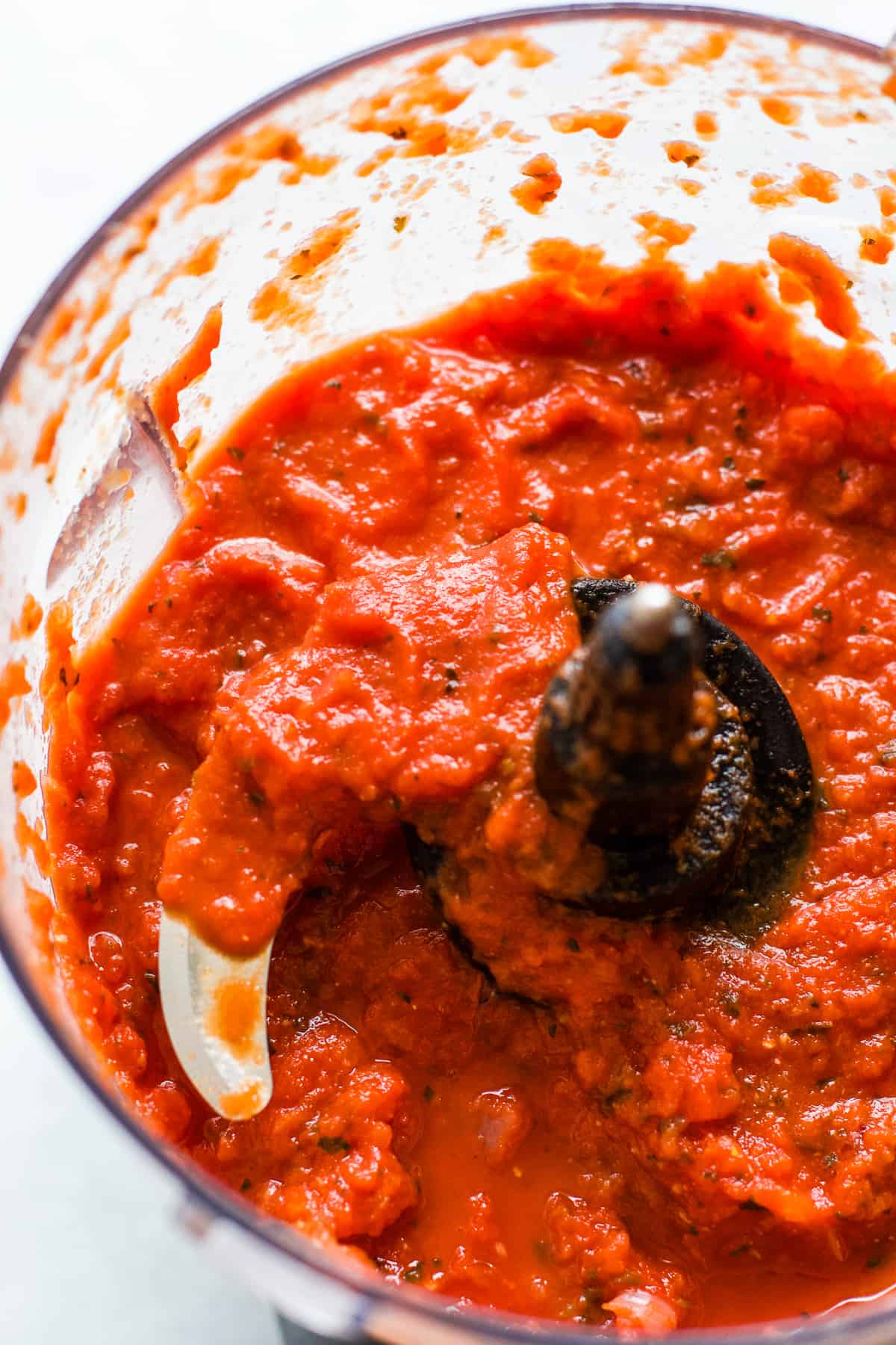 Five ingredient marinara sauce blended in food processor with some texture left slightly chunky.