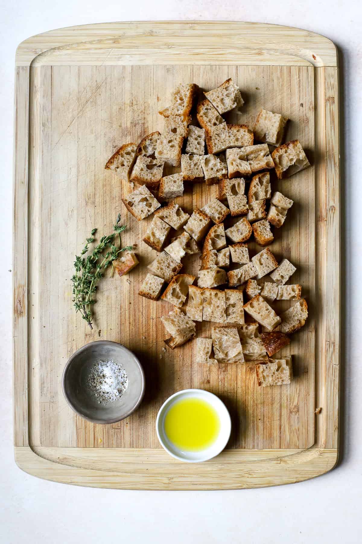 Sourdough bread cut into cubes for making croutons.