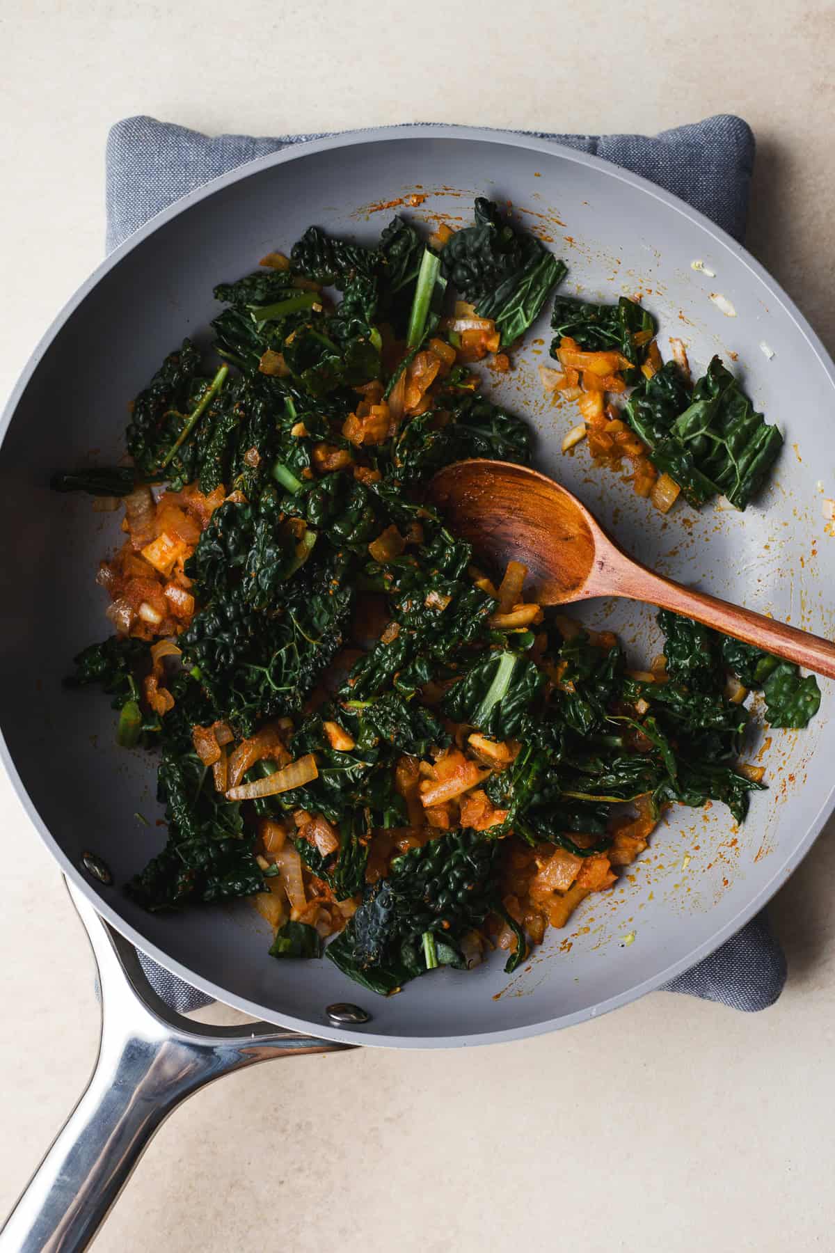 Add kale and sauté with aromatics in a skillet.