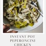 Instant Pot peperoncini chicken shredded in a bowl with a fork.