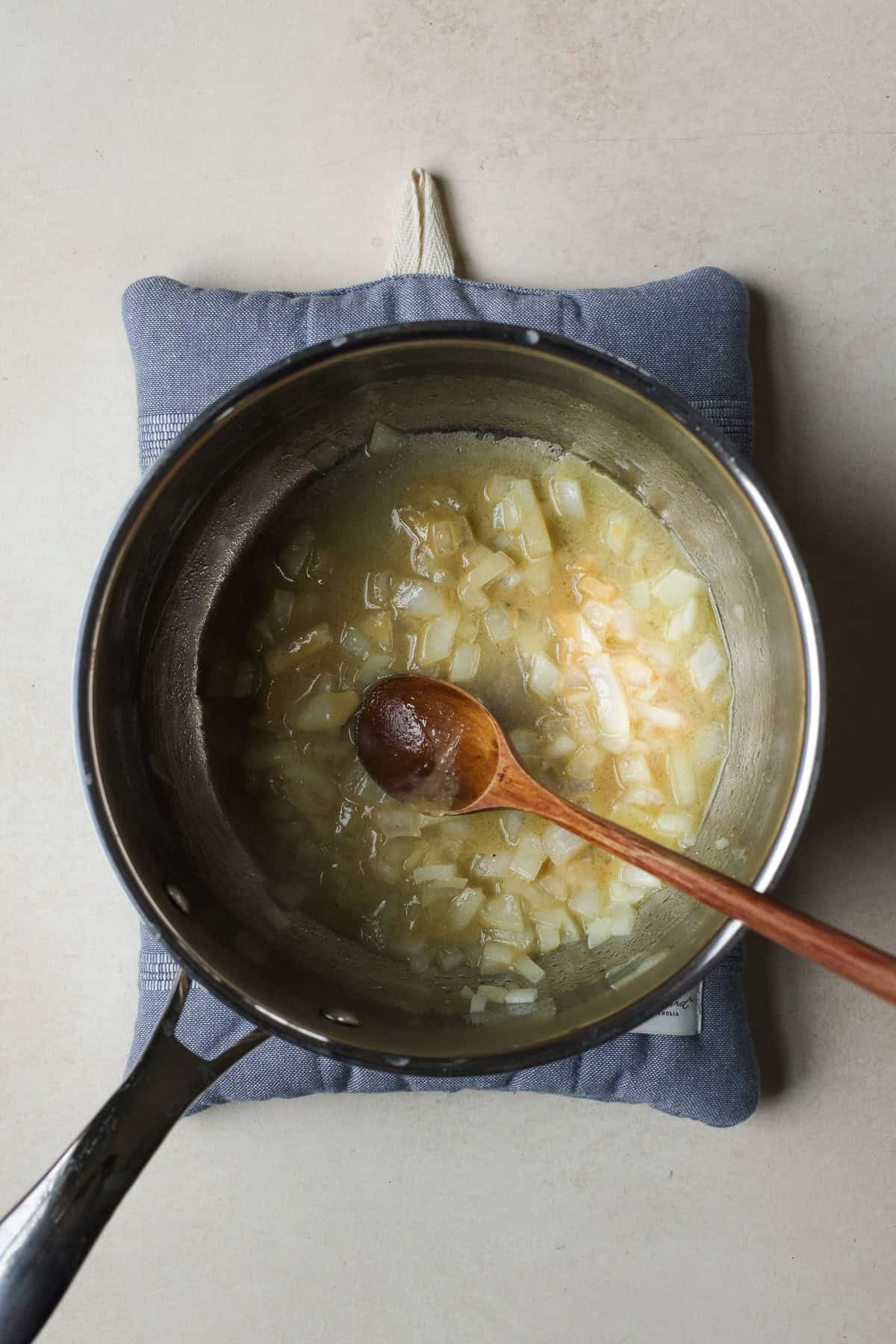 Sautéing miso and onion in a pot.