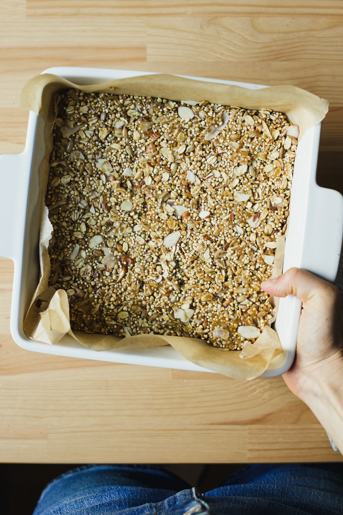 Pressed granola bars in pan, ready to bake.